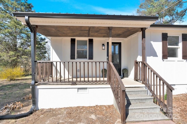 doorway to property with covered porch