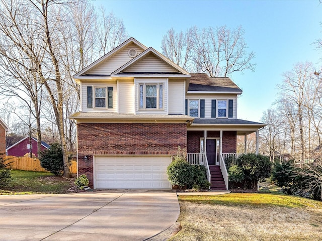 traditional-style home featuring driveway, fence, covered porch, an attached garage, and brick siding