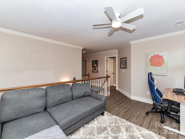 living room with visible vents, baseboards, ornamental molding, wood finished floors, and a ceiling fan