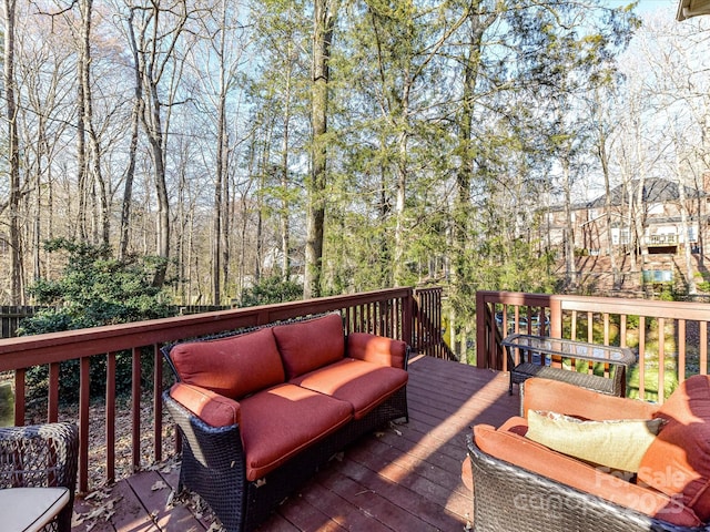 wooden terrace featuring an outdoor hangout area