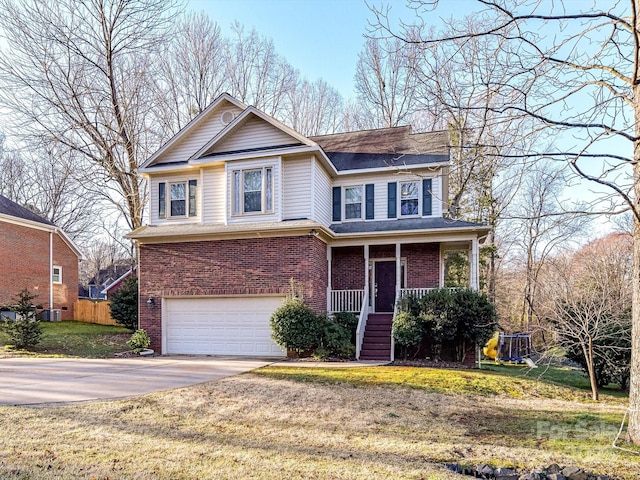 view of front facade with an attached garage, covered porch, concrete driveway, a front lawn, and brick siding