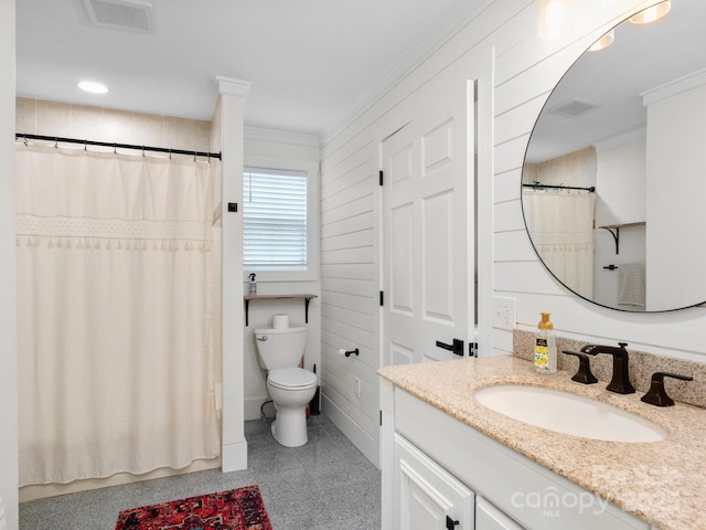 bathroom featuring vanity, crown molding, toilet, and visible vents