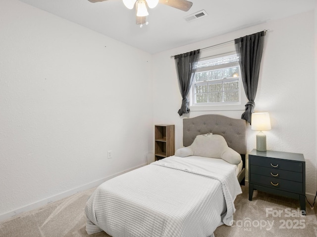 bedroom with a ceiling fan, carpet, visible vents, and baseboards