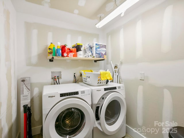 clothes washing area featuring laundry area and washing machine and dryer