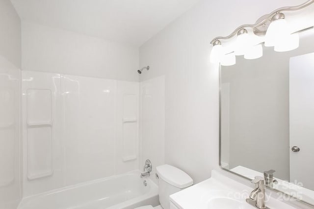 bathroom with toilet,  shower combination, and vanity