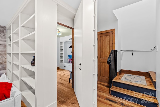 staircase featuring wood finished floors