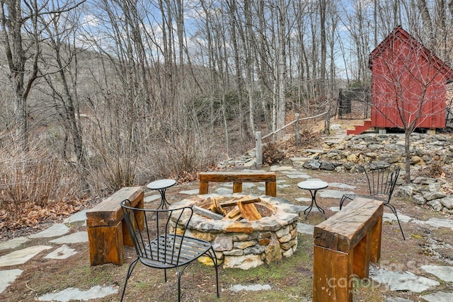 view of yard with a fire pit