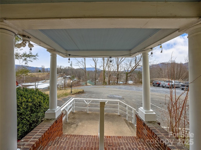 view of patio with covered porch and a mountain view