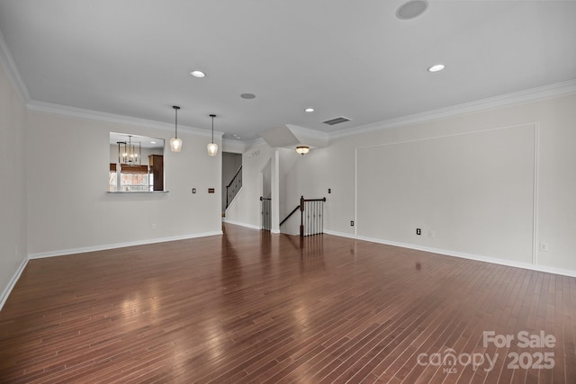 unfurnished living room featuring stairs, wood finished floors, and ornamental molding