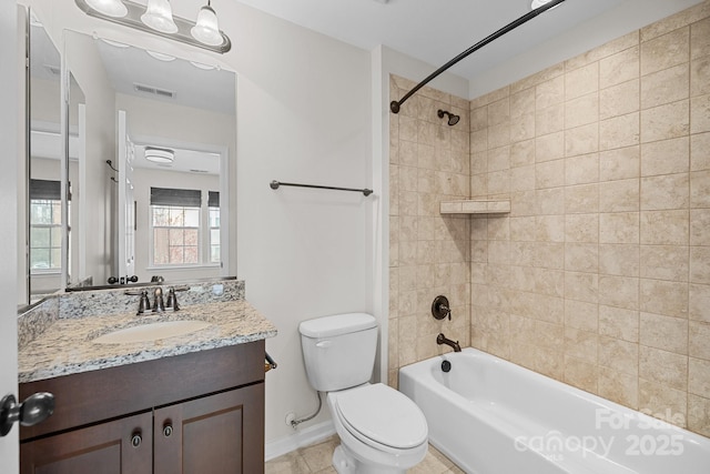 full bathroom with tile patterned floors, visible vents, toilet,  shower combination, and vanity