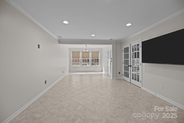 spare room featuring ornamental molding, recessed lighting, french doors, baseboards, and a chandelier