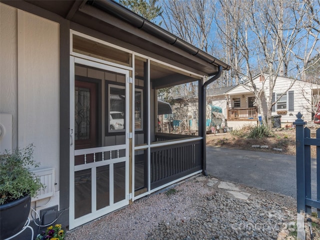 view of side of property featuring a sunroom