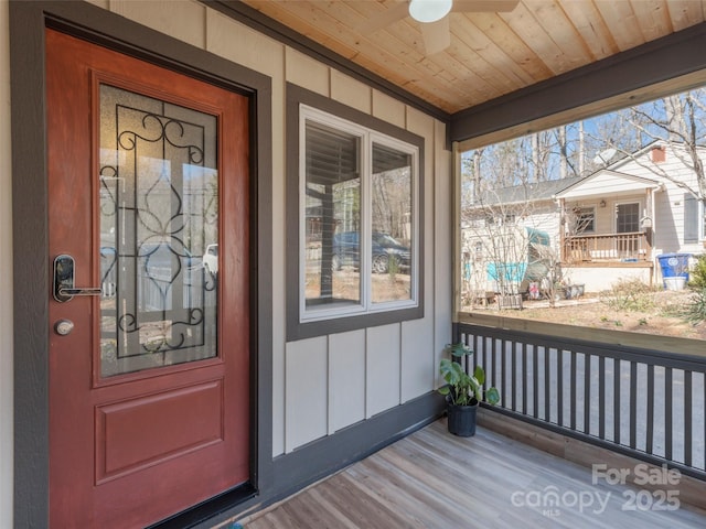 entrance to property featuring a porch and board and batten siding