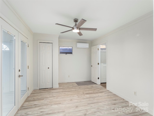 unfurnished bedroom with light wood-type flooring, a wall unit AC, and ornamental molding