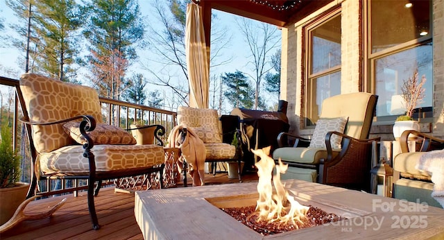 exterior space featuring a fire pit and a deck