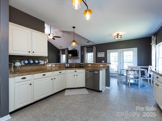 kitchen with lofted ceiling, a peninsula, hanging light fixtures, white cabinets, and stainless steel dishwasher