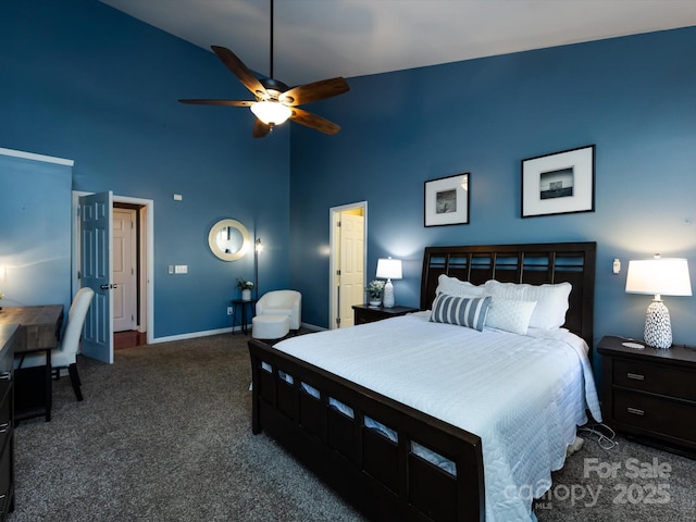 carpeted bedroom featuring a ceiling fan, baseboards, and a towering ceiling