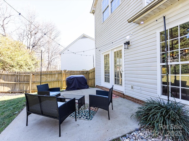 view of patio / terrace with a grill, outdoor lounge area, and fence