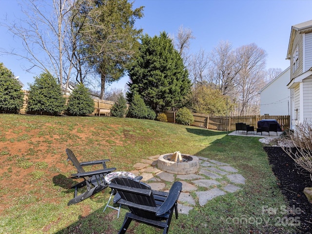 view of yard with a patio area, a fire pit, and fence