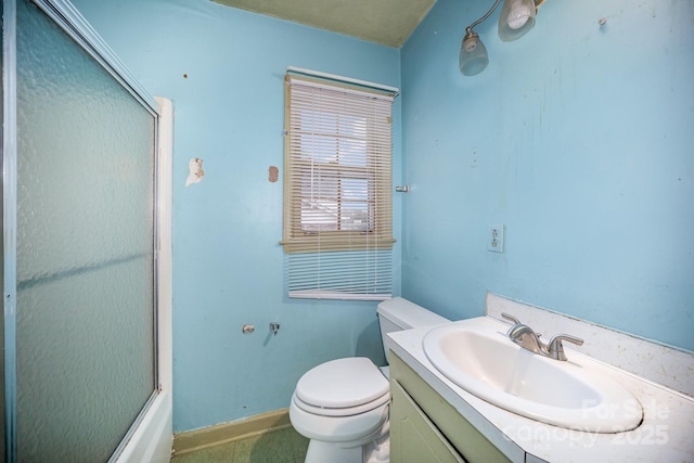 full bathroom with baseboards, toilet, and vanity