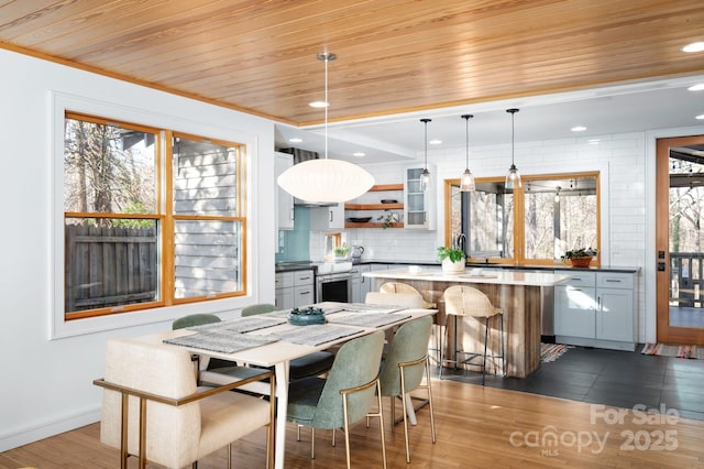 dining area with recessed lighting, baseboards, wood ceiling, and dark wood-style floors