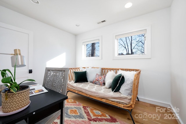 home office featuring recessed lighting, wood finished floors, visible vents, and baseboards