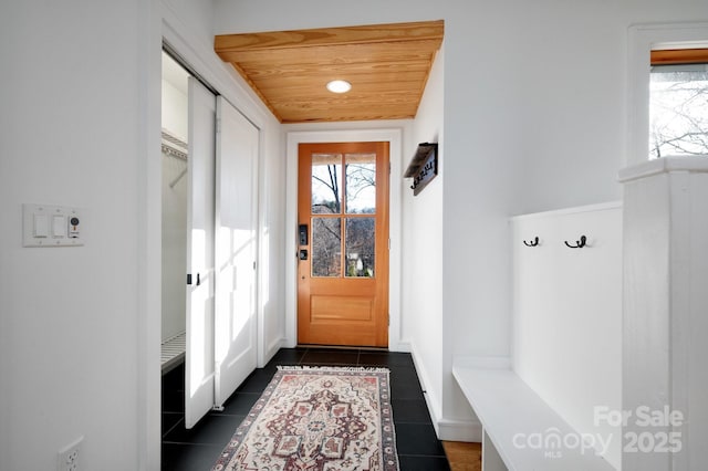 122AND124 Shelburne Rd, Asheville, NC 28806 - mudroom with dark tile patterned flooring, healthy amount of natural light, and baseboards