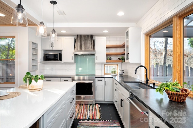 122AND124 Shelburne Rd, Asheville, NC 28806 - kitchen featuring wall chimney range hood, a sink, appliances with stainless steel finishes, recessed lighting, and decorative backsplash