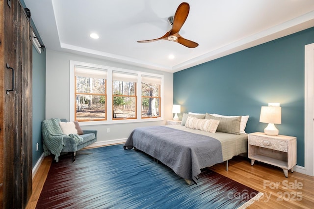 122AND124 Shelburne Rd, Asheville, NC 28806 - bedroom with a barn door, baseboards, wood finished floors, and recessed lighting