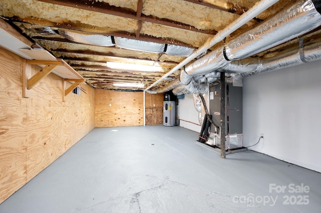 122AND124 Shelburne Rd, Asheville, NC 28806 - unfinished below grade area featuring heating unit and heat pump water heater