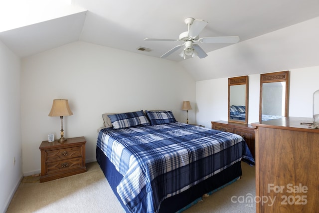 carpeted bedroom with visible vents, baseboards, a ceiling fan, and vaulted ceiling