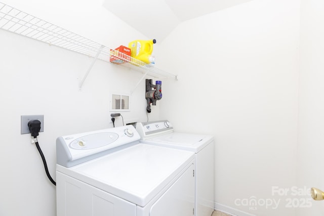 washroom with washer and clothes dryer, laundry area, and visible vents