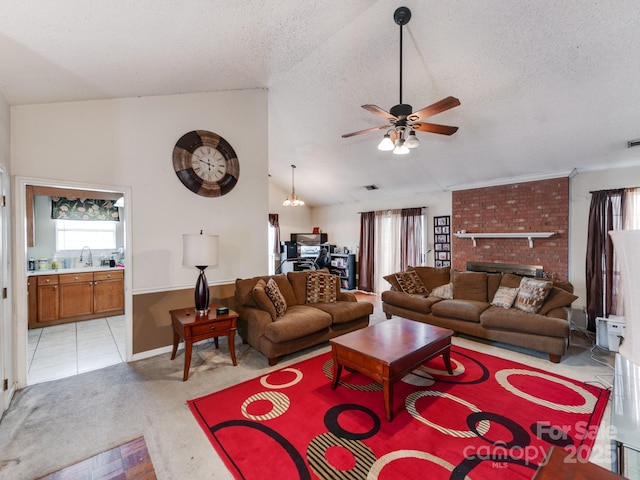 living area with light colored carpet, a textured ceiling, lofted ceiling, and ceiling fan