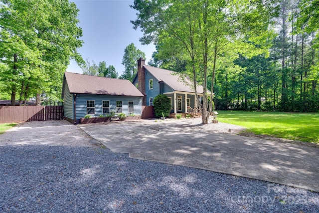 6688 Pine Forest Dr, York, SC 29745 - view of front facade with driveway, a chimney, and a shingled roof