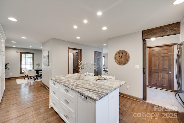 6688 Pine Forest Dr, York, SC 29745 - kitchen with light wood-style floors, white cabinetry, freestanding refrigerator, recessed lighting, and a center island