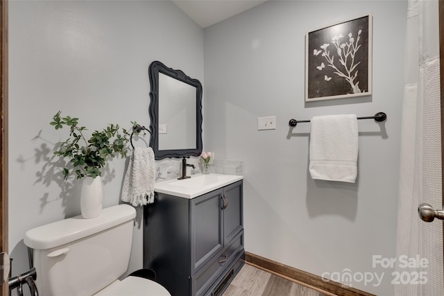6688 Pine Forest Dr, York, SC 29745 - full bath featuring wood finished floors, toilet, vanity, and baseboards
