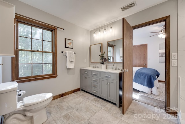 6688 Pine Forest Dr, York, SC 29745 - ensuite bathroom with toilet, baseboards, double vanity, and ceiling fan