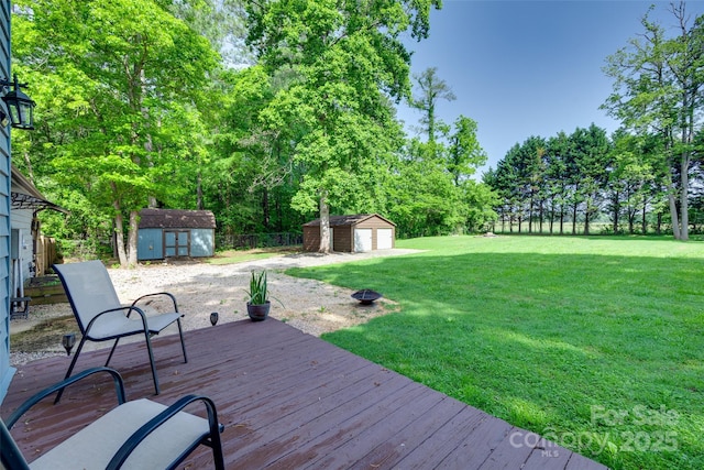6688 Pine Forest Dr, York, SC 29745 - wooden terrace with a storage shed, an outbuilding, and a garage