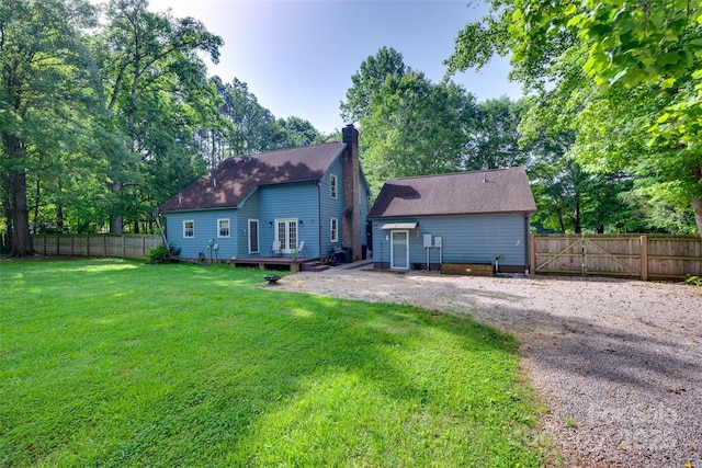 6688 Pine Forest Dr, York, SC 29745 - back of property with a deck, a chimney, view of scattered trees, and roof with shingles