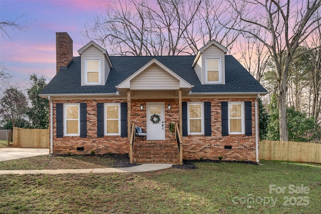 view of front of home with fence, brick siding, and crawl space