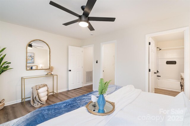 bedroom with visible vents, wood finished floors, connected bathroom, baseboards, and ceiling fan