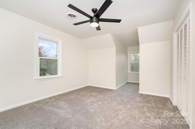 unfurnished bedroom featuring visible vents, baseboards, ceiling fan, carpet flooring, and a closet