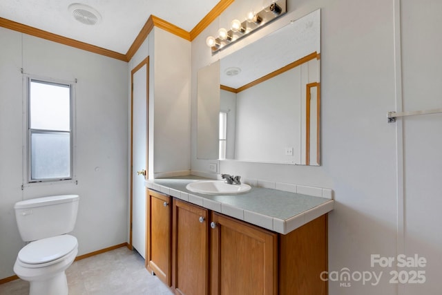 bathroom with visible vents, baseboards, toilet, ornamental molding, and vanity