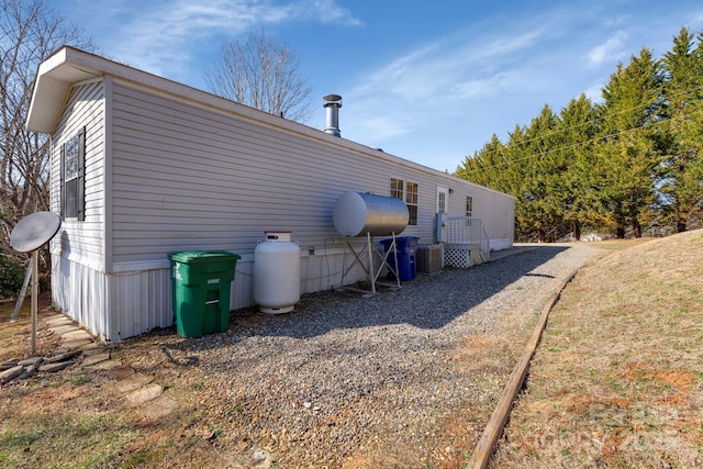 back of house featuring central AC unit