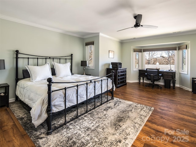 bedroom featuring wood finished floors, baseboards, and ornamental molding