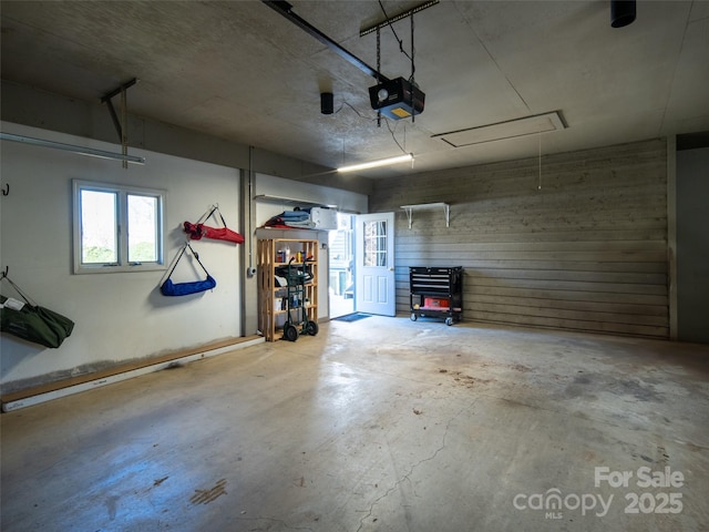 garage featuring a garage door opener