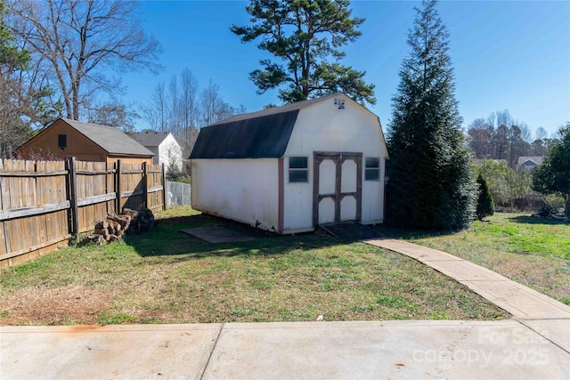 view of shed with fence