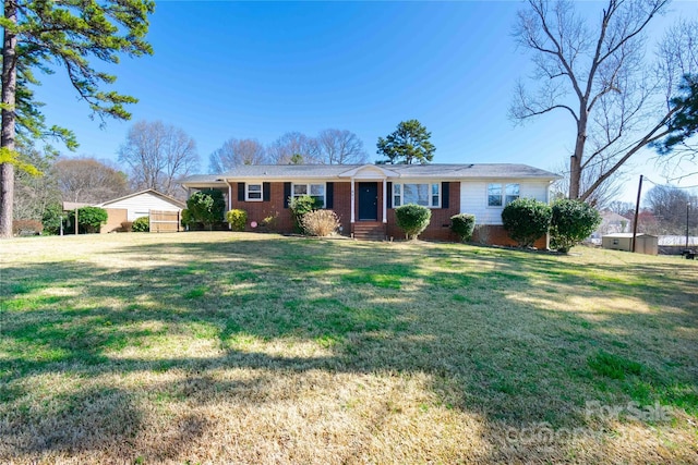 single story home with brick siding, a front lawn, and entry steps