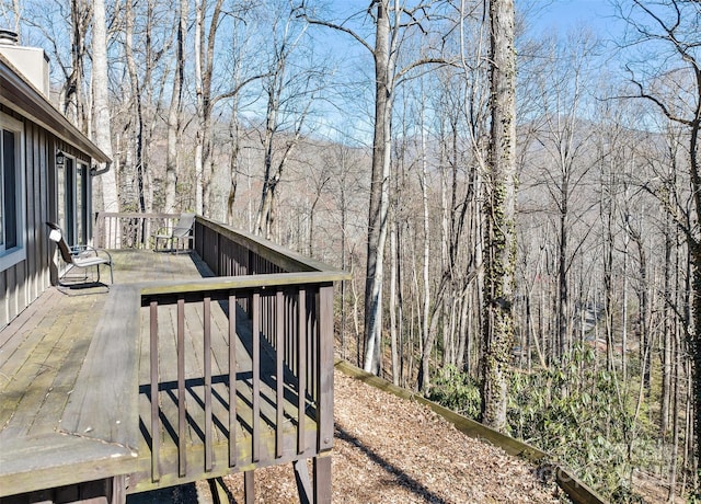 wooden deck featuring a view of trees