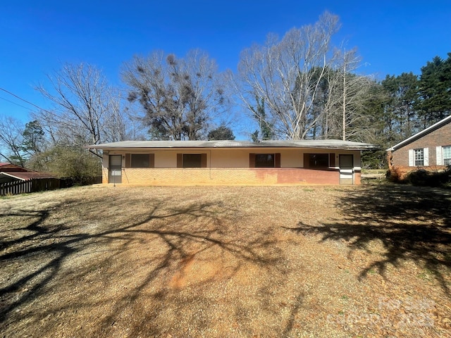 rear view of house with stucco siding